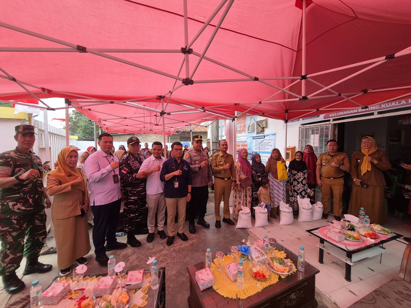 Wakapolres Tanjungbalai Hadiri Penyerahan Bantuan Pangan Beras di Teluk Nibung